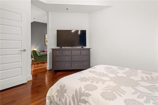 1080 Peachtree St NE Unit 2108, Atlanta, GA 30309 - bedroom featuring dark wood-style floors