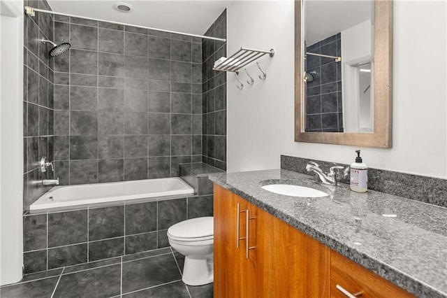 1080 Peachtree St NE Unit 2108, Atlanta, GA 30309 - bathroom featuring vanity, tiled shower / bath, and tile patterned floors
