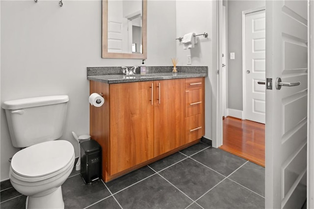 1080 Peachtree St NE Unit 2108, Atlanta, GA 30309 - bathroom featuring vanity, tile patterned floors, and toilet