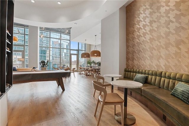1080 Peachtree St NE Unit 2108, Atlanta, GA 30309 - game room with wallpapered walls, floor to ceiling windows, an accent wall, healthy amount of natural light, and a towering ceiling
