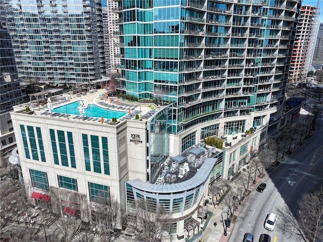 1080 Peachtree St NE Unit 2108, Atlanta, GA 30309 - view of building exterior with a community pool