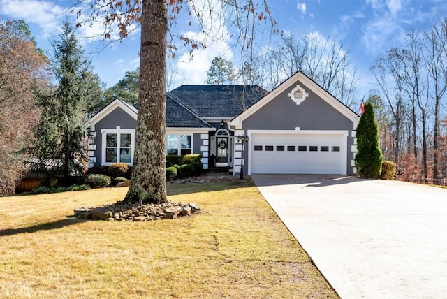 ranch-style house featuring a garage and a front lawn