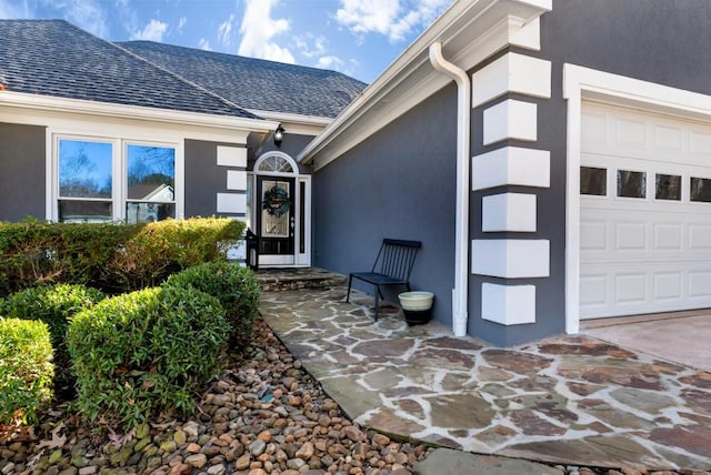 doorway to property featuring a garage