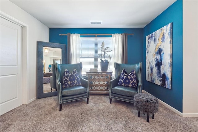 sitting room with carpet floors