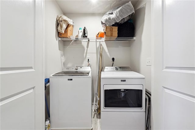 washroom with washing machine and dryer