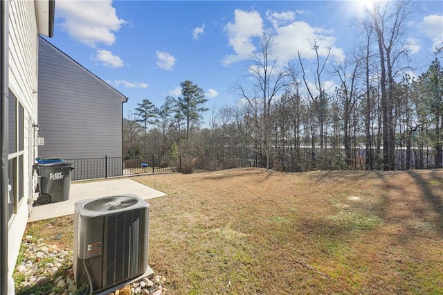 view of yard featuring a patio area and central air condition unit