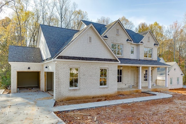 view of front facade with a garage and covered porch