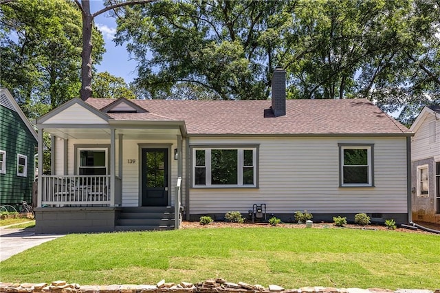 139 Sisson Ave NE, Atlanta, GA 30317 - view of front of house featuring covered porch, a chimney, and a front lawn