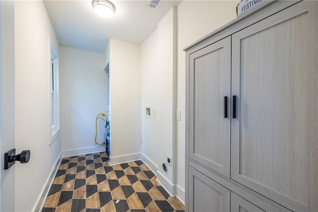139 Sisson Ave NE, Atlanta, GA 30317 - washroom featuring baseboards, washer hookup, cabinet space, and hookup for an electric dryer