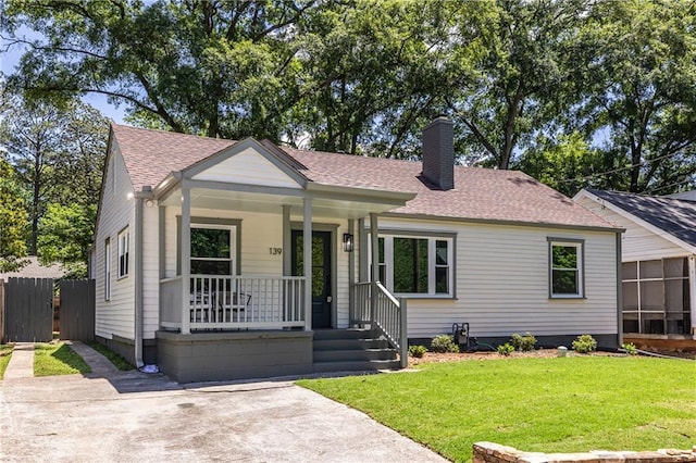 139 Sisson Ave NE, Atlanta, GA 30317 - view of front of property featuring covered porch, a chimney, and a shingled roof