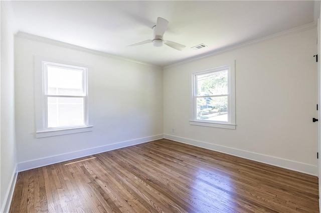 139 Sisson Ave NE, Atlanta, GA 30317 - spare room featuring ornamental molding, wood finished floors, baseboards, and a ceiling fan