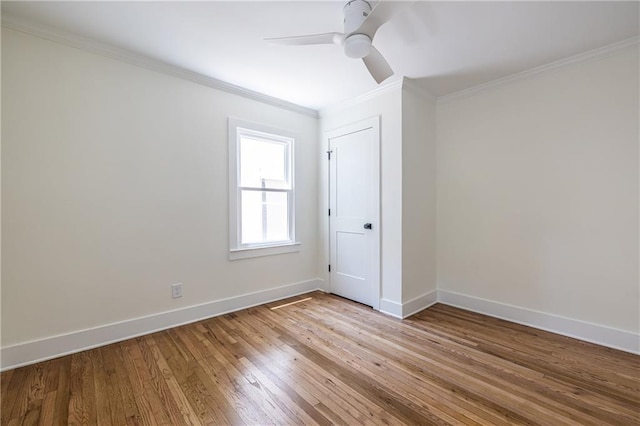139 Sisson Ave NE, Atlanta, GA 30317 - unfurnished room with crown molding, wood finished floors, baseboards, and a ceiling fan