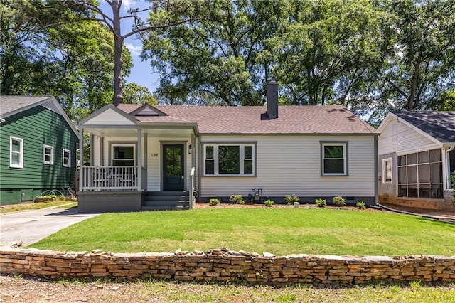 139 Sisson Ave NE, Atlanta, GA 30317 - view of front of house featuring a porch, a chimney, a front lawn, and a shingled roof