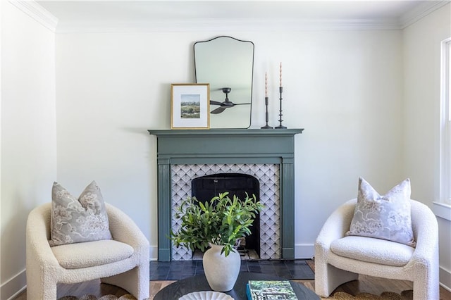 139 Sisson Ave NE, Atlanta, GA 30317 - sitting room with crown molding, baseboards, a tiled fireplace, and a ceiling fan