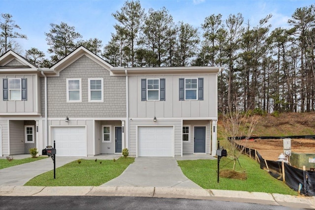 4258 SW Notting Hill Dr Unit 32, Atlanta, GA 30331 - townhome / multi-family property with board and batten siding, driveway, a garage, and a front lawn