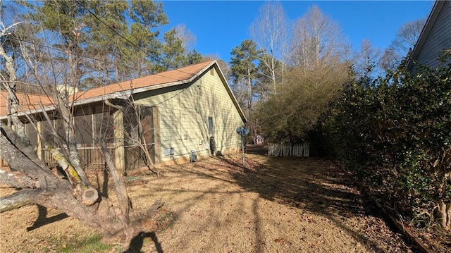 view of home's exterior with a sunroom