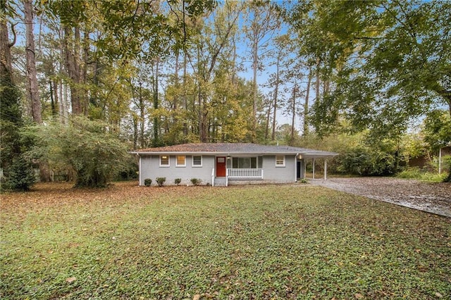 3449 Misty Valley Rd, Decatur, GA 30032 - ranch-style house featuring gravel driveway, a front yard, and a carport