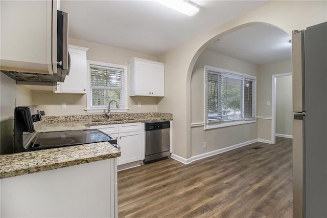 3449 Misty Valley Rd, Decatur, GA 30032 - kitchen with stainless steel dishwasher, a sink, electric range, and arched walkways