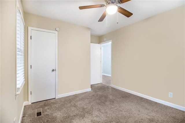 3449 Misty Valley Rd, Decatur, GA 30032 - unfurnished bedroom with carpet flooring, baseboards, and a ceiling fan