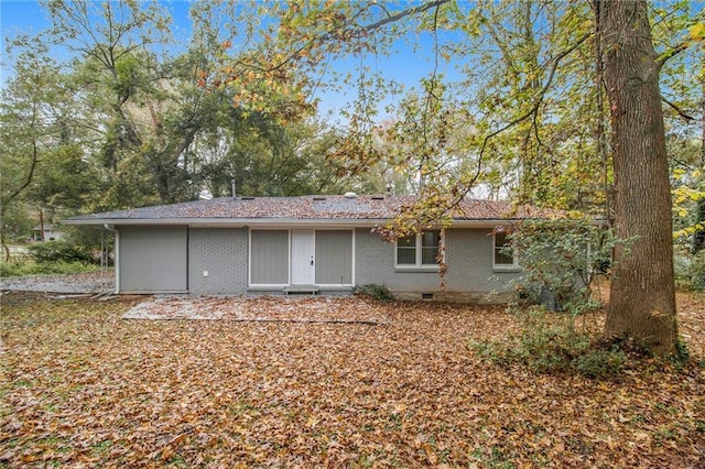 3449 Misty Valley Rd, Decatur, GA 30032 - rear view of house featuring brick siding and crawl space