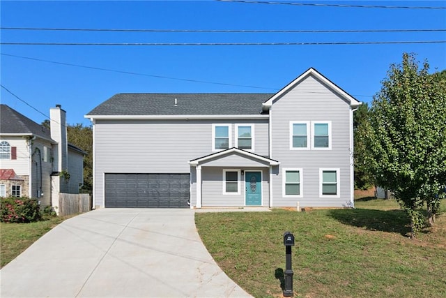 view of front facade featuring a front yard and a garage