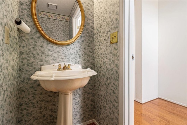 1900 Green Oak Cir, Lawrenceville, GA 30043 - bathroom with wood finished floors and wallpapered walls