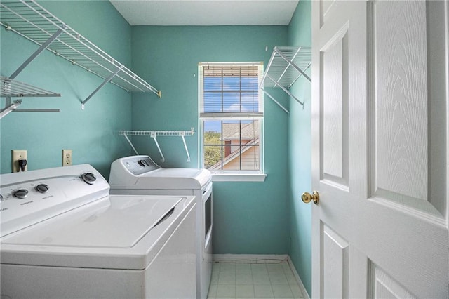 1900 Green Oak Cir, Lawrenceville, GA 30043 - laundry room with washing machine and clothes dryer and tile patterned flooring
