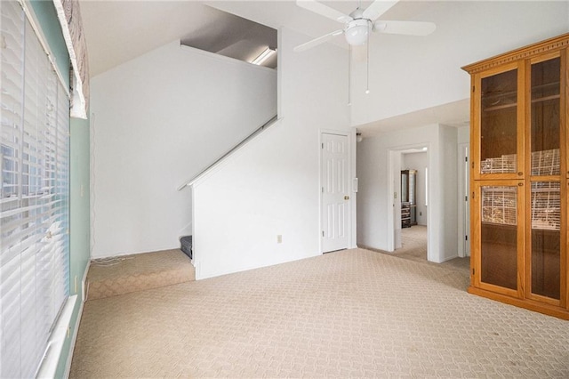 1900 Green Oak Cir, Lawrenceville, GA 30043 - unfurnished living room with carpet, stairway, a ceiling fan, and high vaulted ceiling