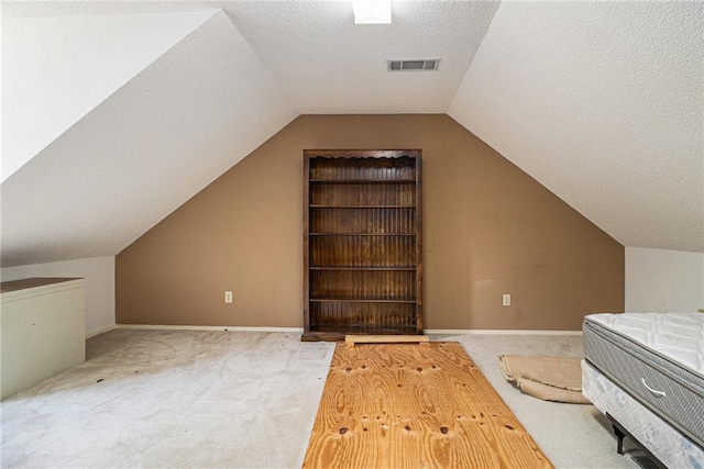 1900 Green Oak Cir, Lawrenceville, GA 30043 - bonus room with carpet flooring, a textured ceiling, and lofted ceiling