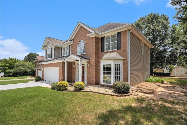 1900 Green Oak Cir, Lawrenceville, GA 30043 - view of front of property with a storage shed, concrete driveway, brick siding, and a front lawn
