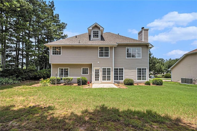 1900 Green Oak Cir, Lawrenceville, GA 30043 - back of property featuring a chimney, a yard, a patio, and a shingled roof