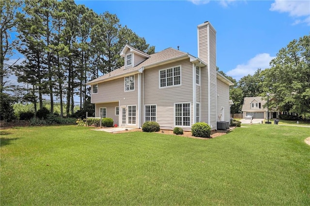 1900 Green Oak Cir, Lawrenceville, GA 30043 - rear view of property featuring a chimney, a lawn, and a patio