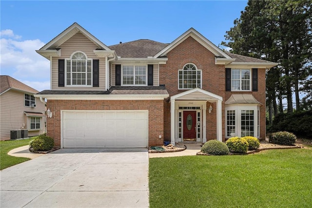 1900 Green Oak Cir, Lawrenceville, GA 30043 - view of front of house with concrete driveway, a front lawn, a garage, and brick siding