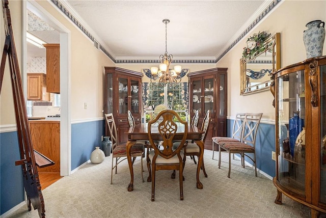 1900 Green Oak Cir, Lawrenceville, GA 30043 - dining room featuring a chandelier, ornamental molding, plenty of natural light, and light carpet