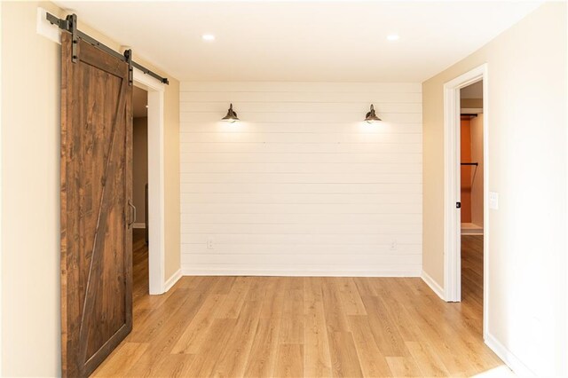 unfurnished room featuring light wood-type flooring