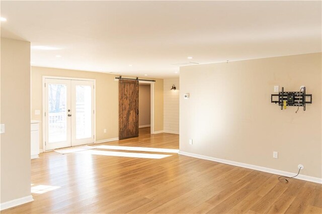 entrance foyer featuring light hardwood / wood-style floors and a wealth of natural light