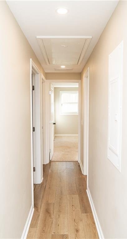 unfurnished bedroom featuring light colored carpet and a closet