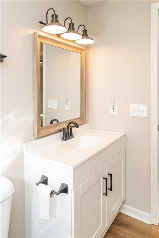 interior space featuring white cabinetry, light hardwood / wood-style flooring, and wood counters