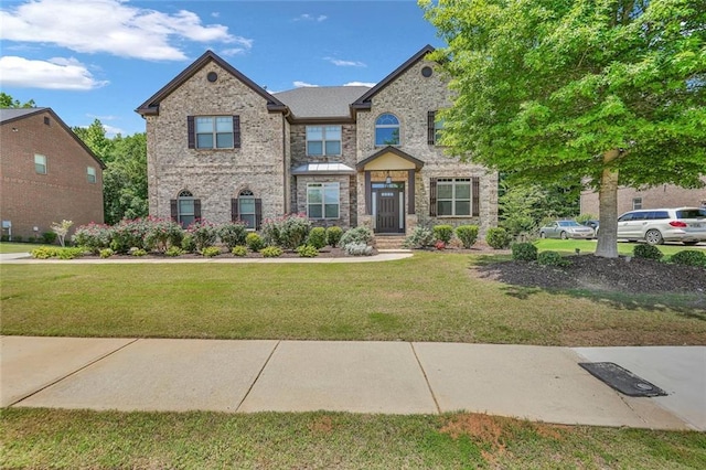 271 Learwood Ln, Atlanta, GA 30349 - craftsman inspired home featuring a front lawn and brick siding