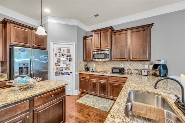 271 Learwood Ln, Atlanta, GA 30349 - kitchen featuring a sink, stainless steel appliances, ornamental molding, dark wood-style floors, and decorative light fixtures