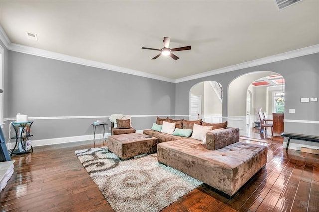 271 Learwood Ln, Atlanta, GA 30349 - living room with arched walkways, ceiling fan, dark wood finished floors, ornamental molding, and baseboards
