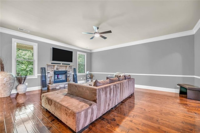 271 Learwood Ln, Atlanta, GA 30349 - living room with a ceiling fan, dark wood-style floors, ornamental molding, a fireplace, and baseboards