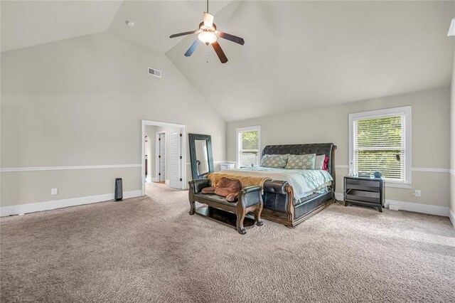 271 Learwood Ln, Atlanta, GA 30349 - bedroom featuring high vaulted ceiling, light carpet, multiple windows, a ceiling fan, and baseboards