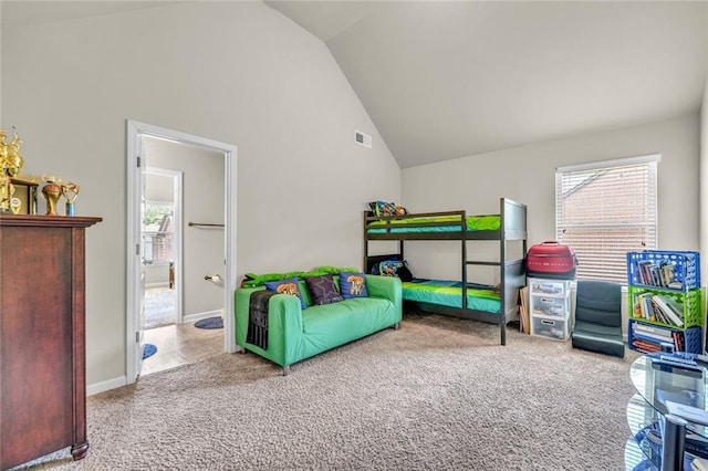 271 Learwood Ln, Atlanta, GA 30349 - bedroom with vaulted ceiling, multiple windows, carpet flooring, and baseboards