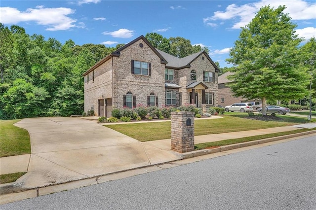 271 Learwood Ln, Atlanta, GA 30349 - view of front of home featuring a front yard and brick siding