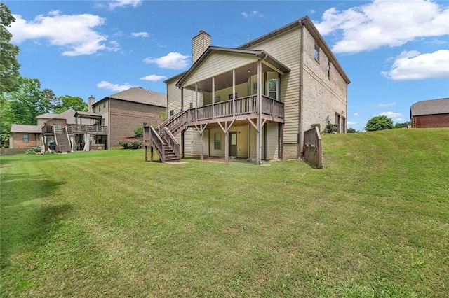 271 Learwood Ln, Atlanta, GA 30349 - rear view of property with stairway, a chimney, a wooden deck, and a yard