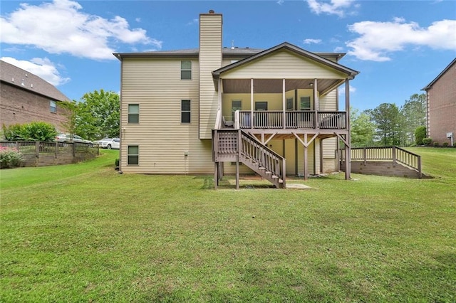 271 Learwood Ln, Atlanta, GA 30349 - rear view of property featuring stairs, a sunroom, a chimney, and a deck