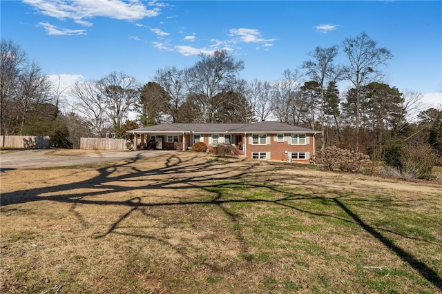 4983 Arcado Rd SW, Lilburn, GA 30047 - view of front of property featuring fence and a front yard