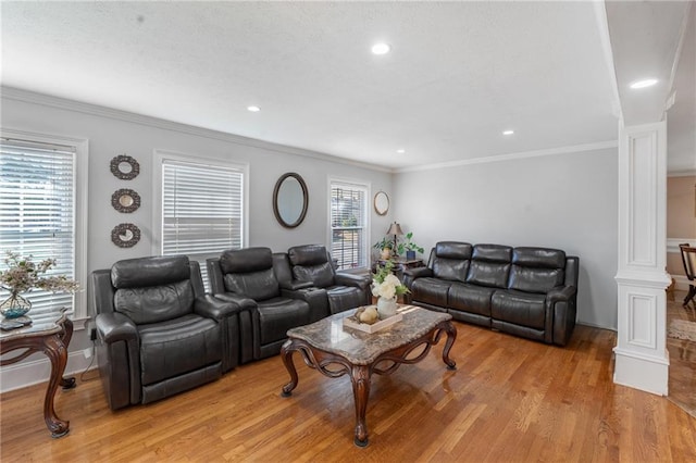 4983 Arcado Rd SW, Lilburn, GA 30047 - living room featuring decorative columns, baseboards, ornamental molding, light wood-type flooring, and recessed lighting