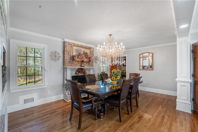 4983 Arcado Rd SW, Lilburn, GA 30047 - dining room featuring ornamental molding, wood finished floors, visible vents, and baseboards